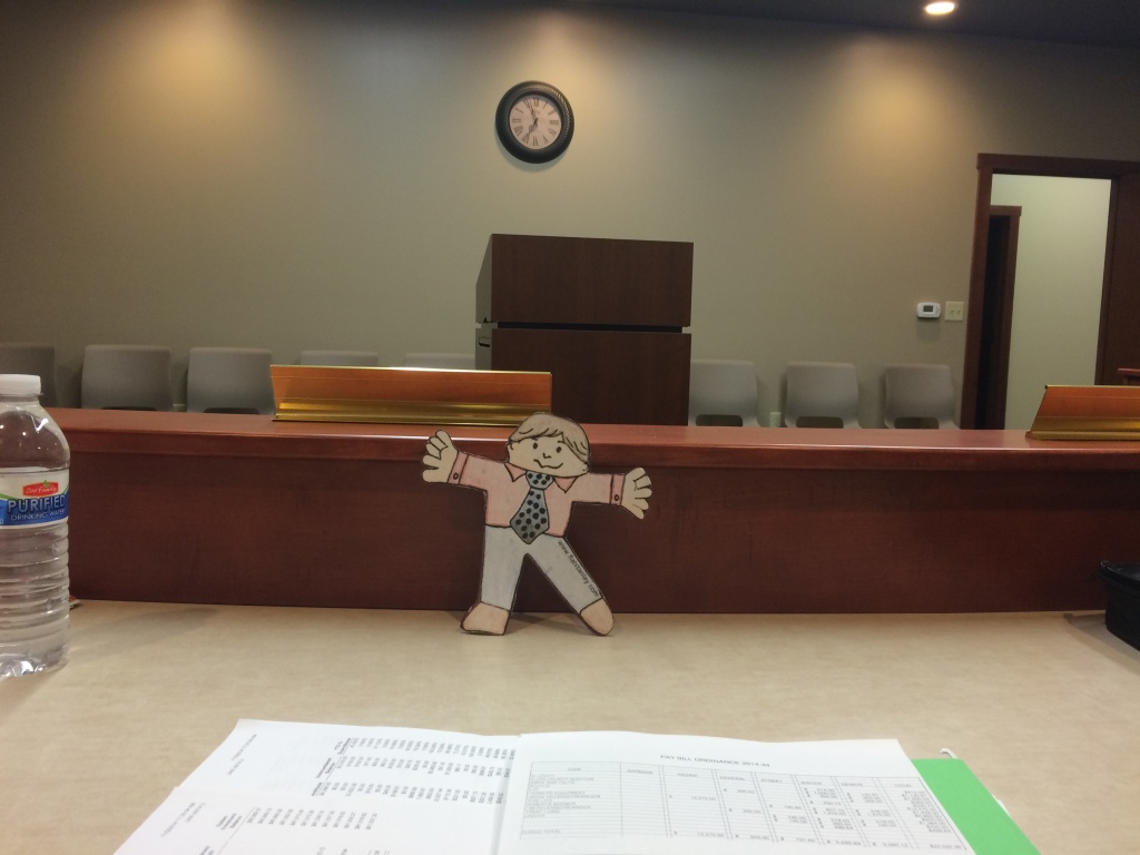 Flat Stanley prepares for the meeting.